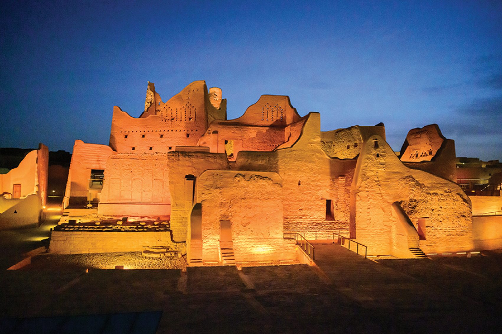 Palwa Palace, a traditional mudbrick structure in Diriyah, lit up at night