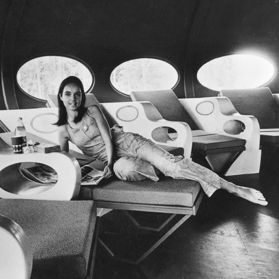 Vintage photograph of a model posing in a Futuro House