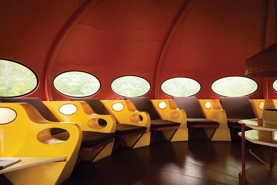 Yellow seats inside.a Futuro House