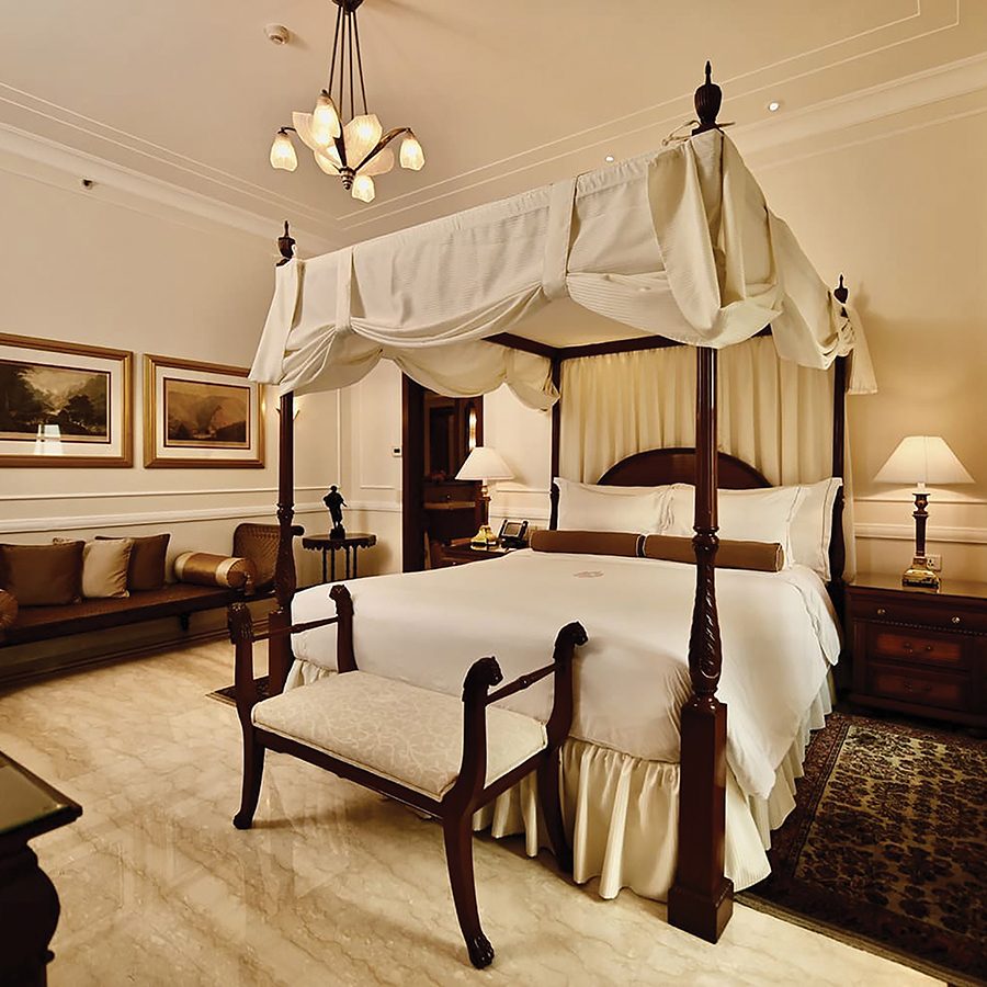 A four-poster bed with a classic sit-out in a Luxury Suite at The Imperial New Delhi