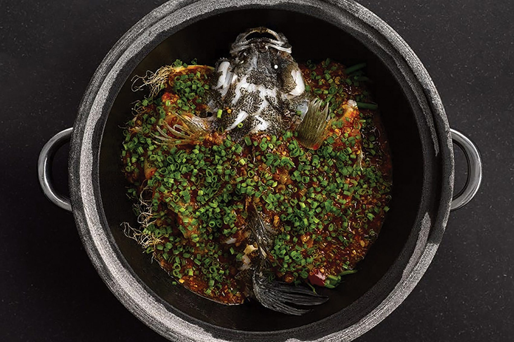 Signature stone pot fish dish at The Bridge, Chengdu