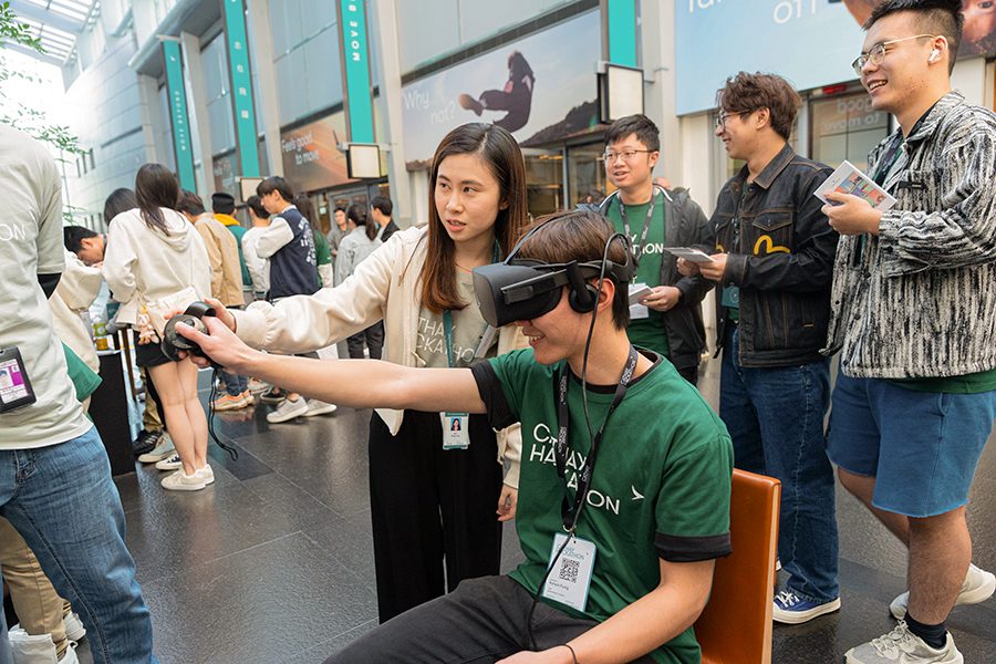 A Cathay Hackathon participant wearing a virtual reality headset