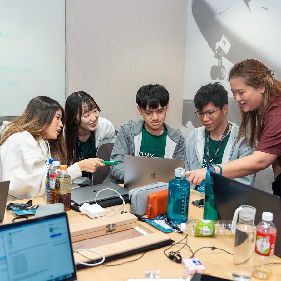 A team of participants in discussion during the hackathon weekend