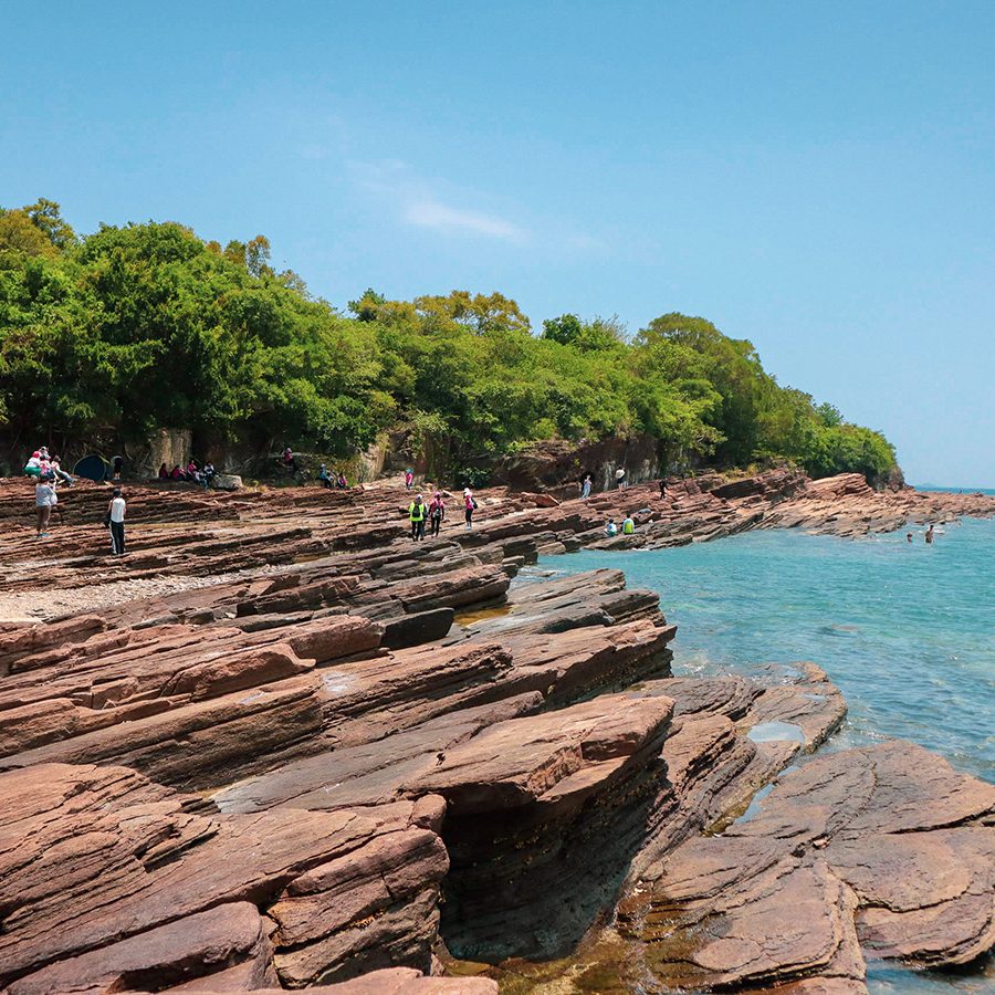Rock formations on the coast of Tung Ping Chau in Hong Kong in the daytime. 