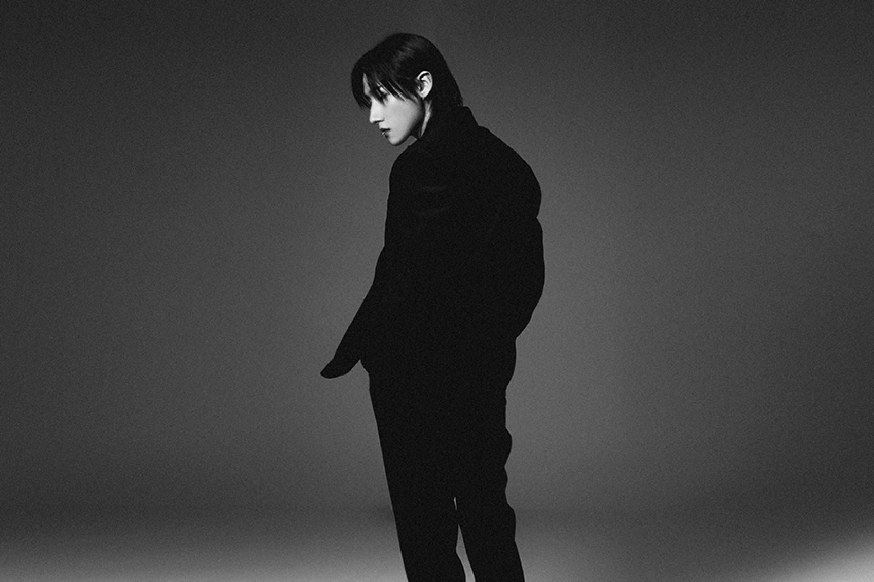 Monsta X member I.M dressed in black