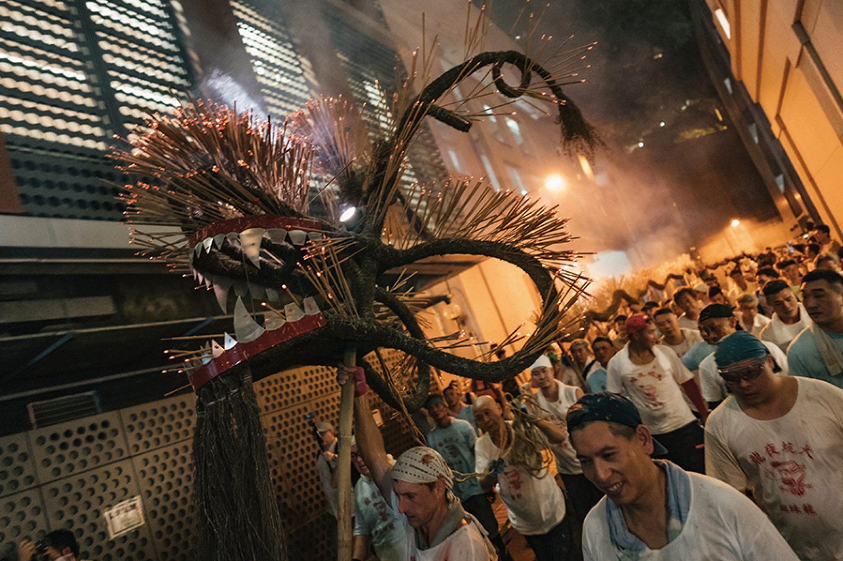 Performers of the Tai Hang Fire Dance holding up the dragon