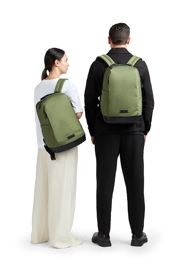 A man and woman wearing wearing green Lojel Eblo backpacks 