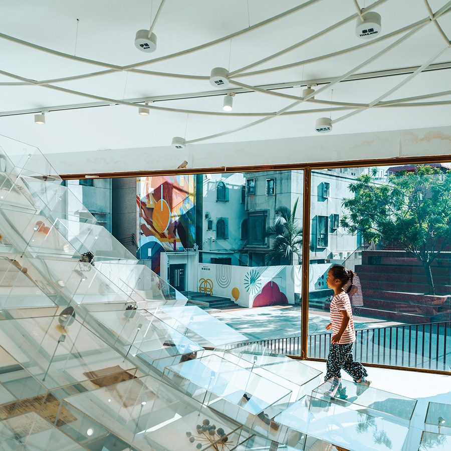 A child playing inside Diverse Homology Museum during daytime