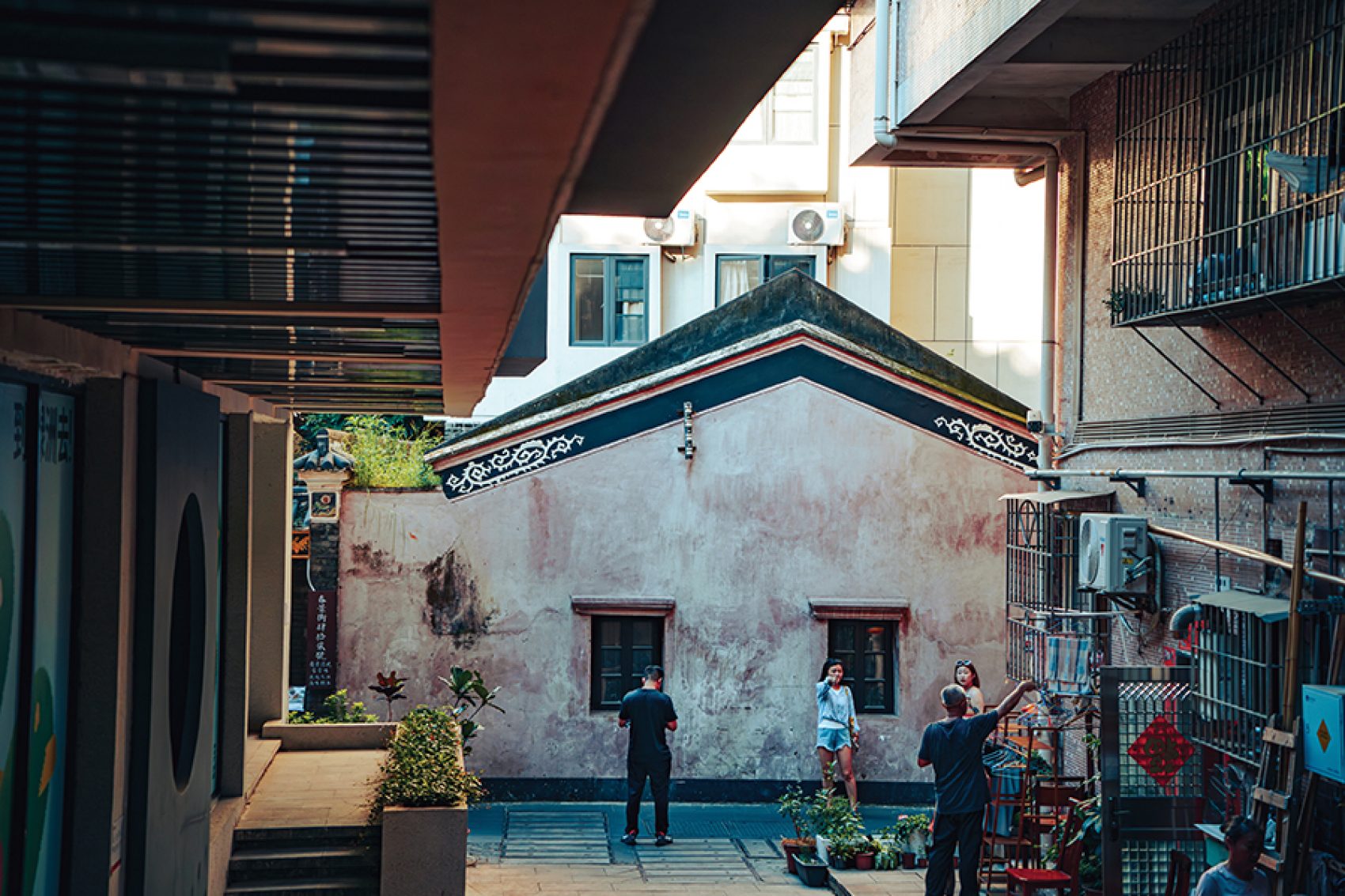 A street view of people standing on Chunjing Street during daytime inside Nantou Ancient City