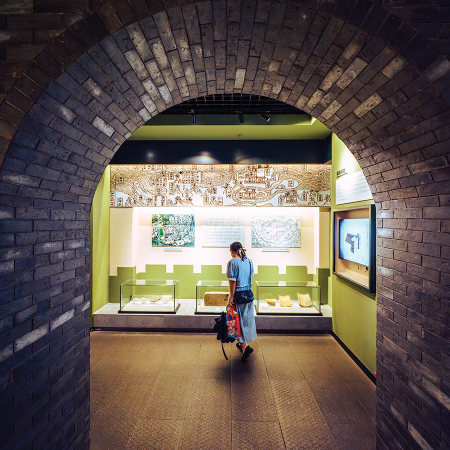 A woman looking at ancient artefacts inside Nantou Ancient City Museum in Shenzhen, China