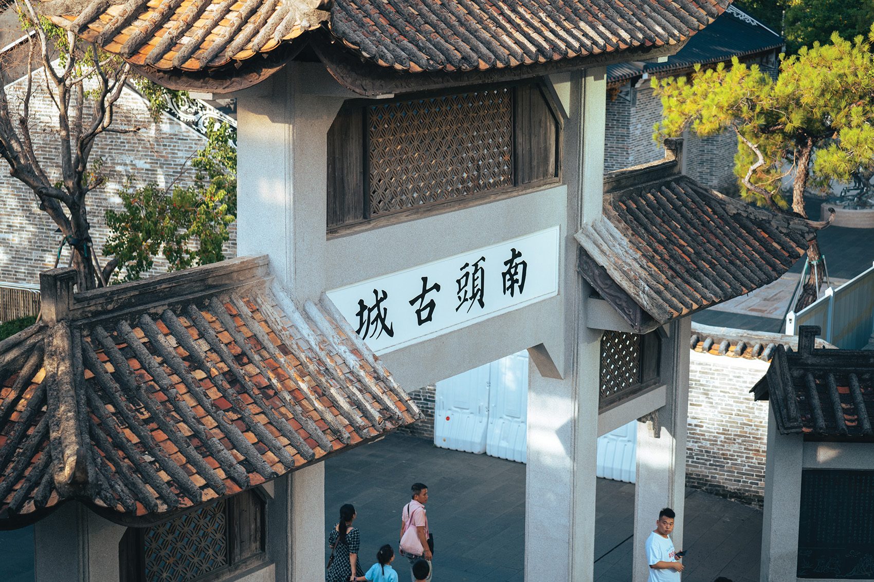 People walking through the South Gate Entrance to Nantou Ancient Town in Shenzhen, China