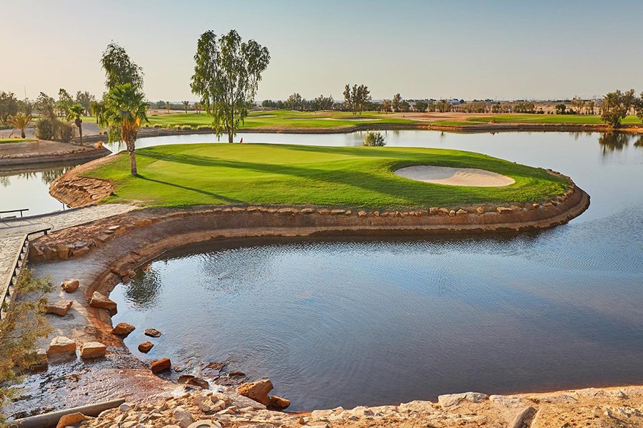 A lake and trees at Riyadh Golf Club 