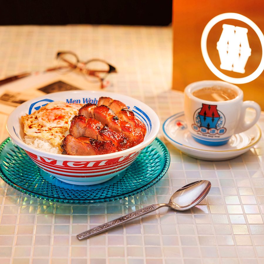 A bowl of char siu egg rice and a cup of milk tea at Men Wah Bing Teng, Hong Kong. 