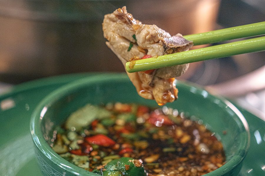 Meat dipped in soy sauce and seasonings at Season in Shenzhen