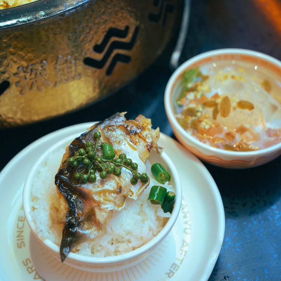 Grilled fish doused in soup on rice at Tanyu