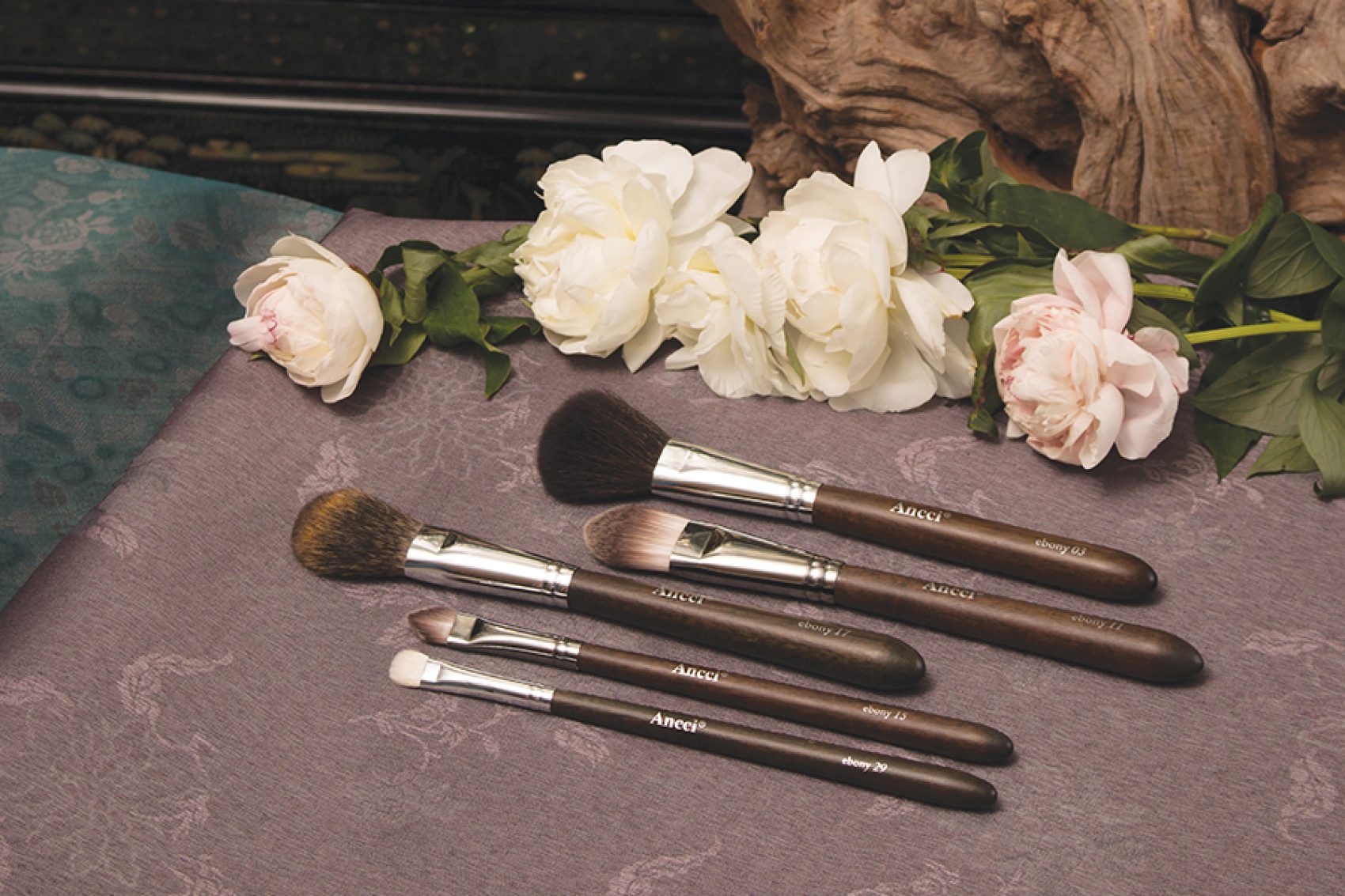 A set of five Ancci ebony makeup brushes