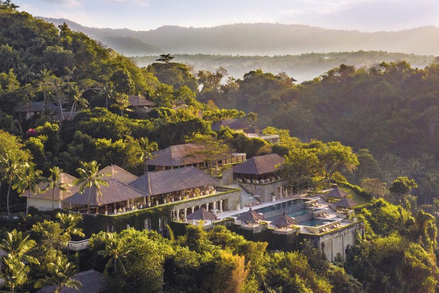 A aerial view of the entirety of the Amankila resort in Bali, Indonesia in sunlight 