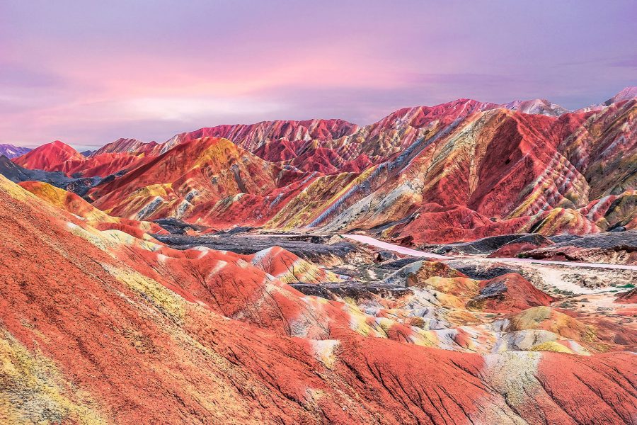 Colourful mountains against a pink sky during sunset 