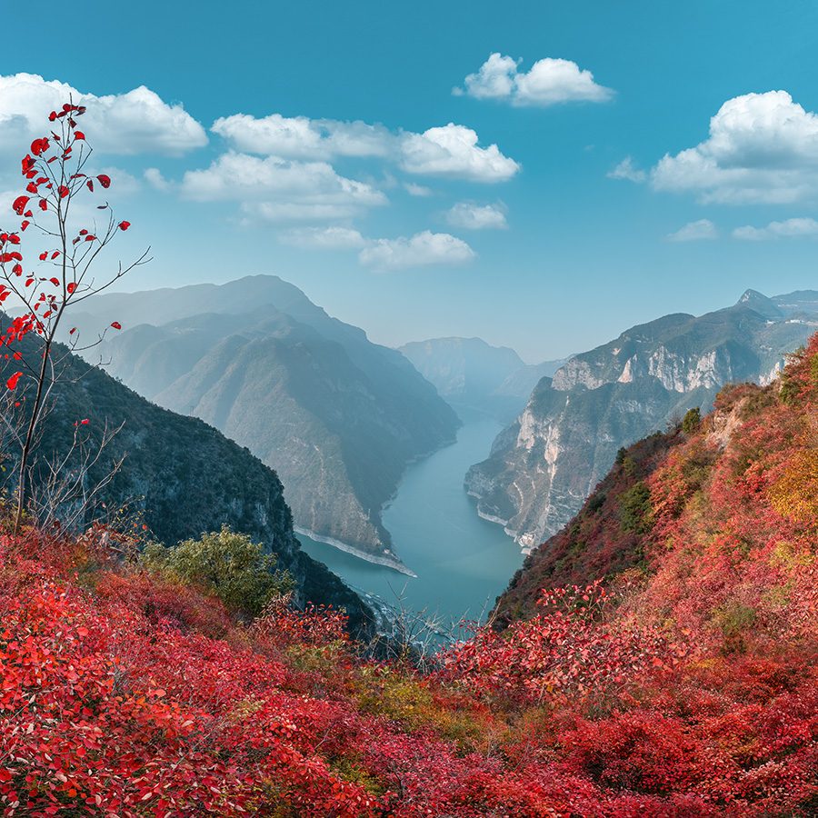 River and mountains with red leaves in Wushan