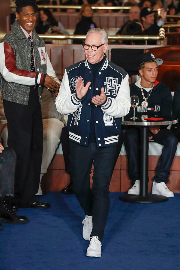 Tommy Hilfiger clapping and walking