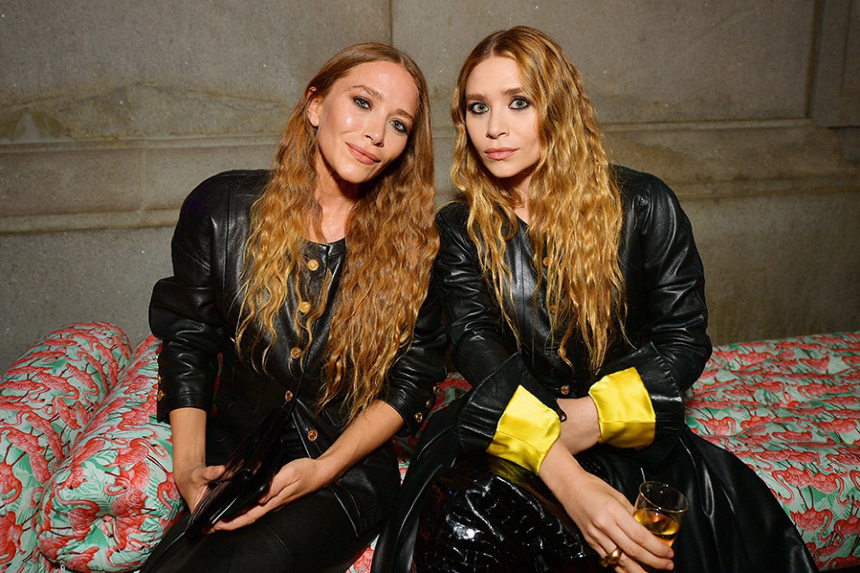 Mary-Kate and Ashley Olsen posing for a picture, promoting their fashion brand The Row. 