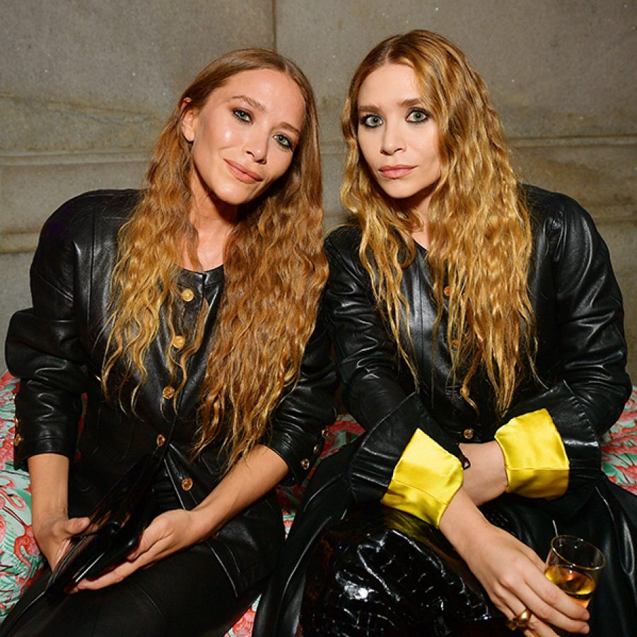Mary-Kate and Ashley Olsen posing for a picture, promoting their fashion brand The Row. 