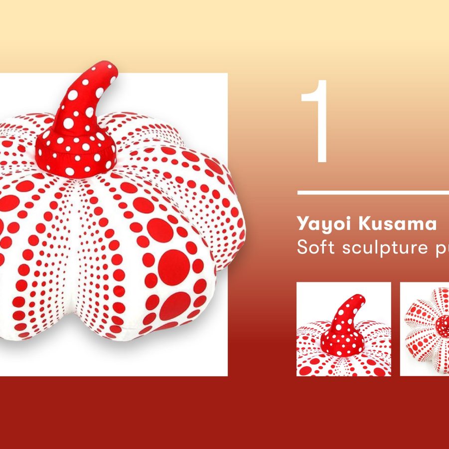 A white pumpkin toy covered in red polka dots.