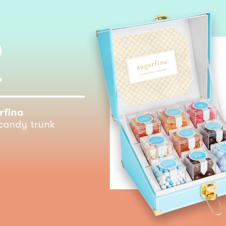 Nine boxes of multicoloured candy inside of a light blue trunk.