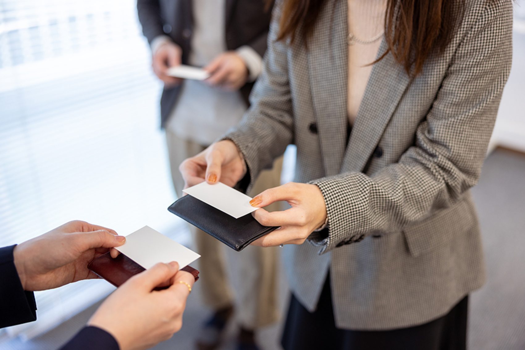 Woman exchanging business cards with someone