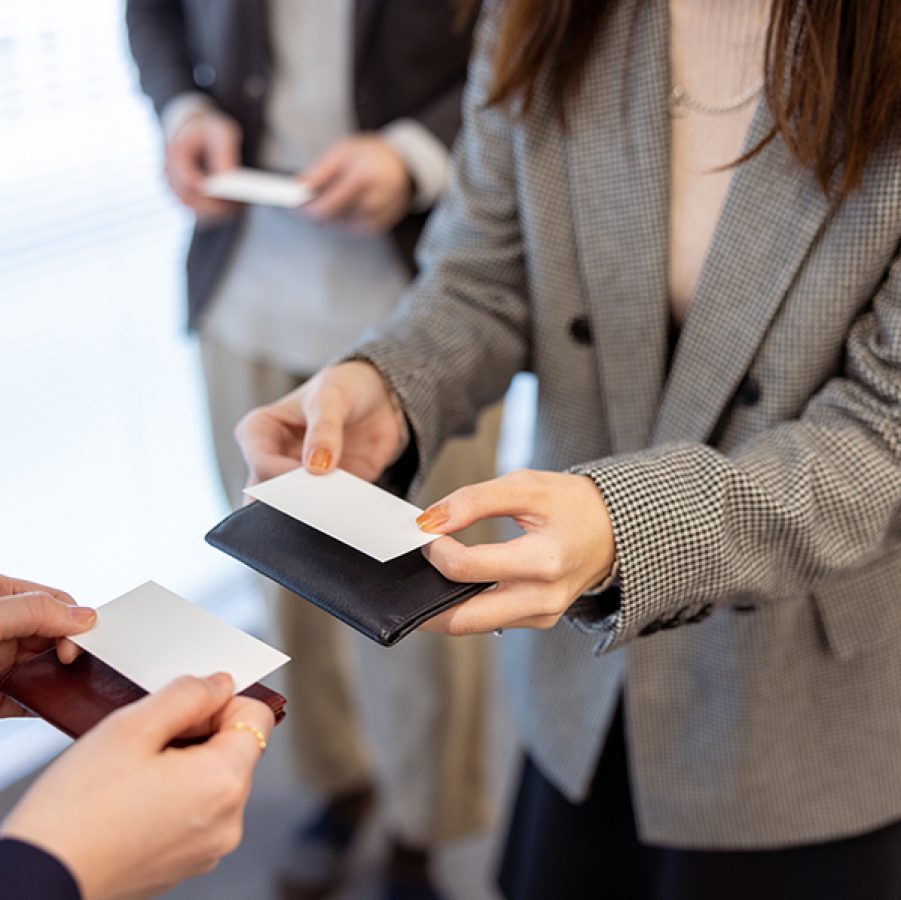 Woman exchanging business cards with someone