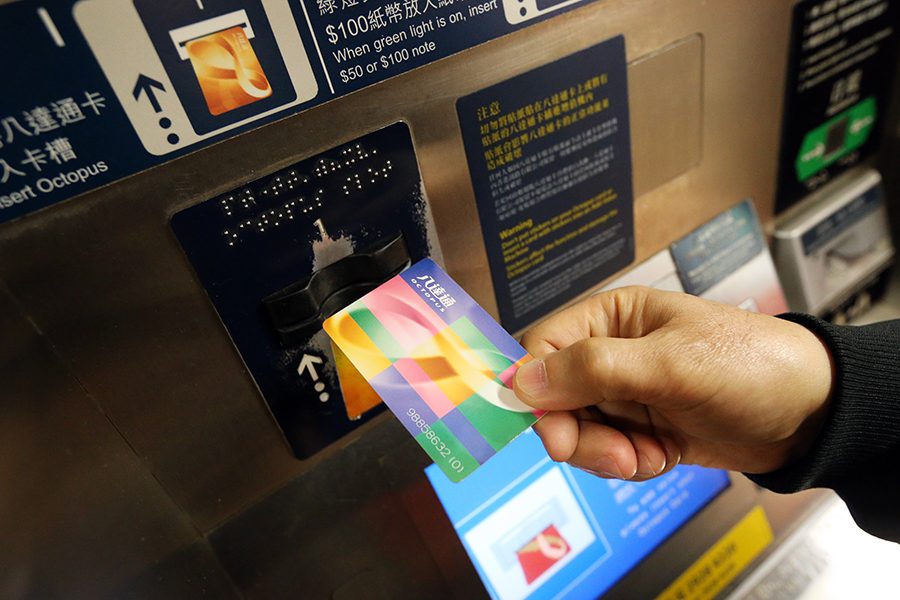Person topping up their Octopus card in Hong Kong