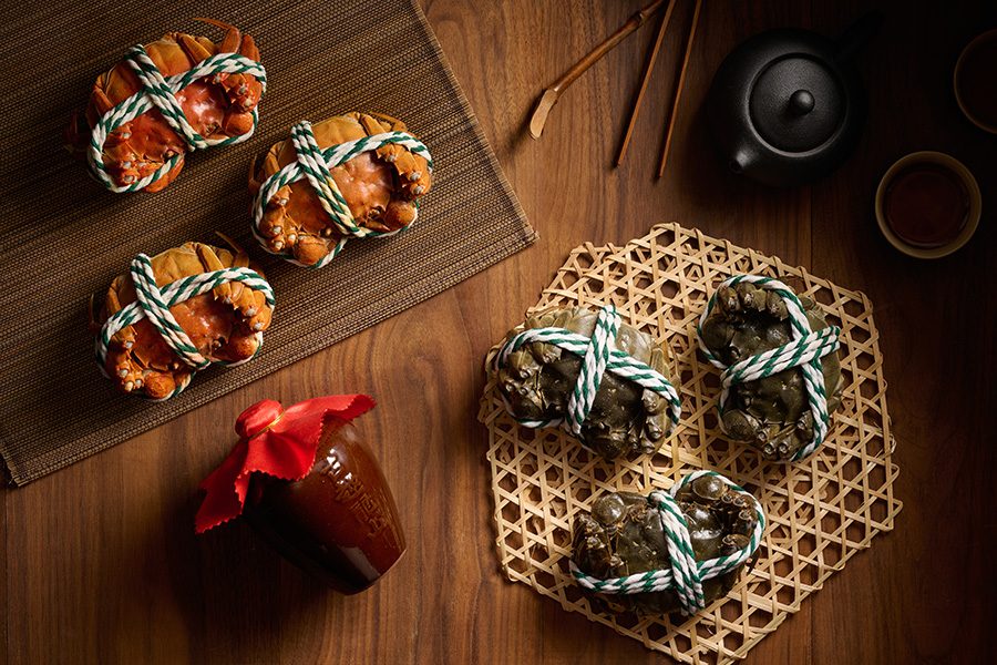 A top-down view of two types of hairy crabs; a choice of steamed or steamed with pot ale and galangal served at Tsz Yuet Heen in Tsuen Kwan O, Hong Kong 