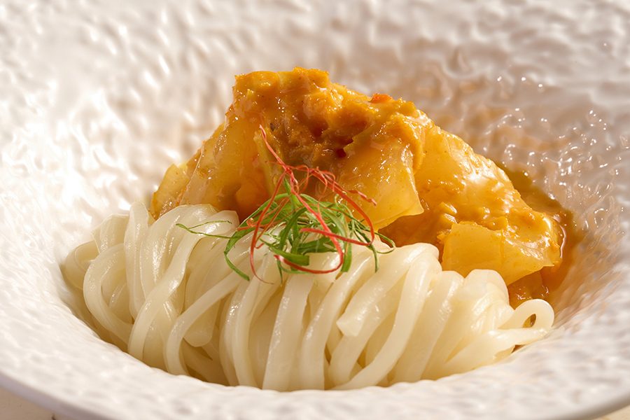 A plate of fresh hairy crab meat, royal fish maw and braised inaniwa udon served at Voynich in Tsim Sha Tsui, Hong Kong 