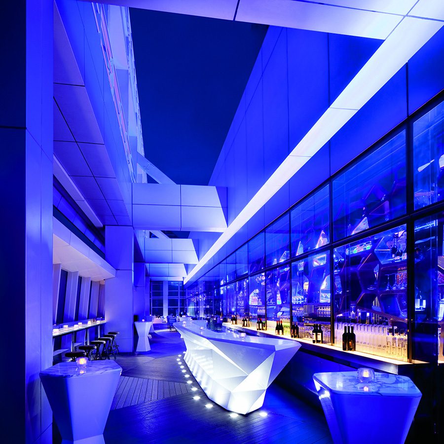 The bar at Ozone, The Ritz-Carlton Hong Kong, seen under blue light. 