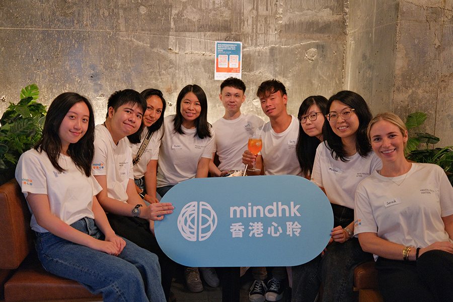 A group poses with a Mind HK sign.