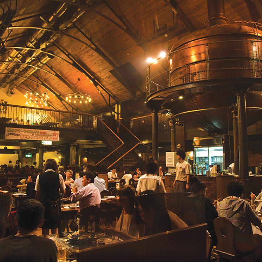 A crowd of diners inside a bar and restaurant at Sapporo Beer Museum Beer Necessities in Hokkaido, Japan