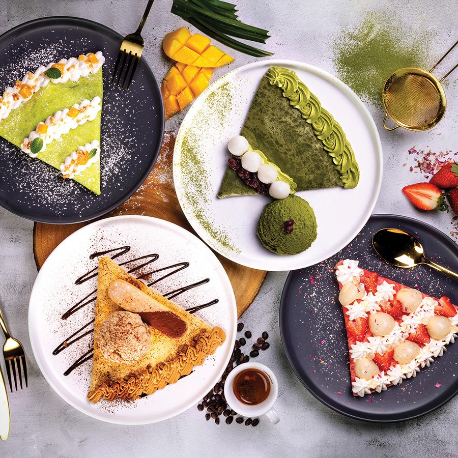 A top-down spread of different-flavoured crepes ranging from matcha to strawberry.