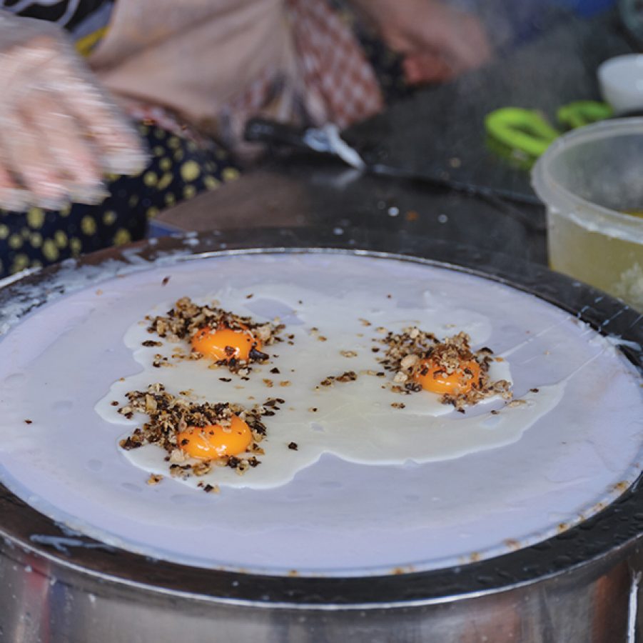 Banh cuon nong being made on the street