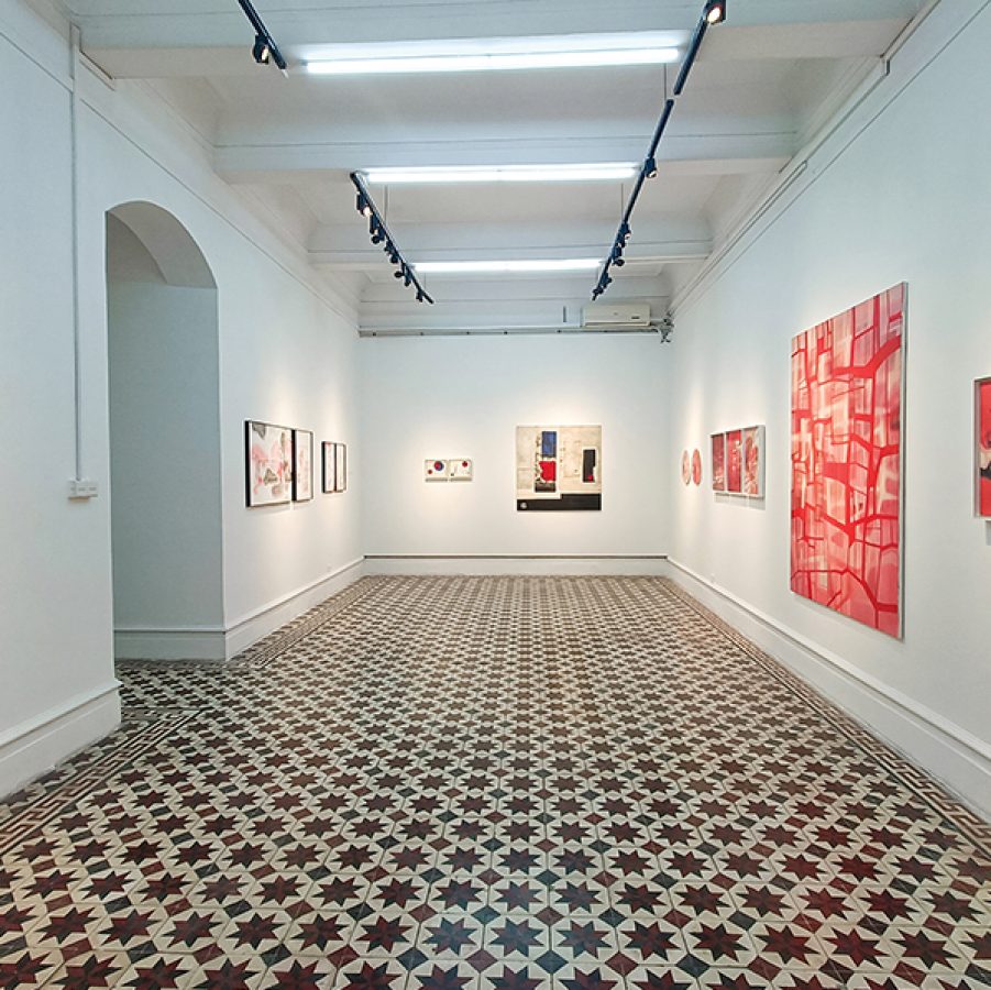 Hallway lined with art inside Kui Yuan Gallery