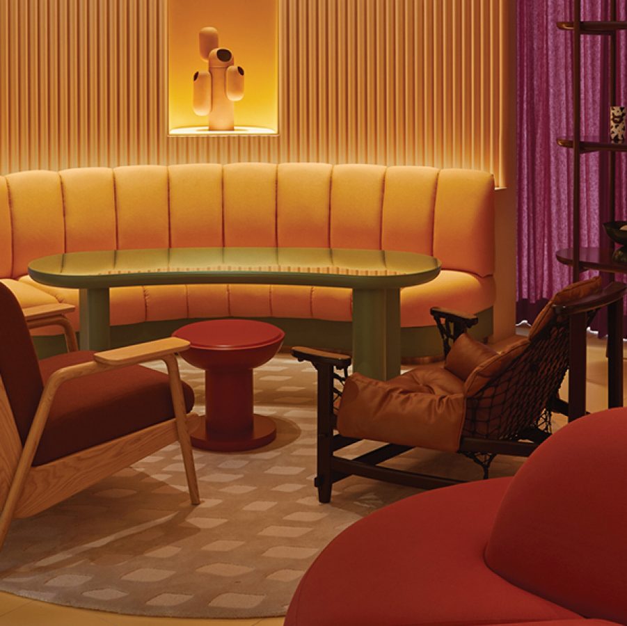 A bright yellow and purple seating area in The Standard, Bangkok Mahanakhon