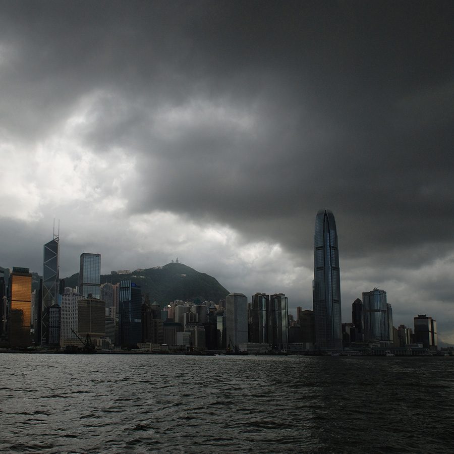 A gloomy photo of grey clouds and dark sky over Hong Kong victoria harbour 