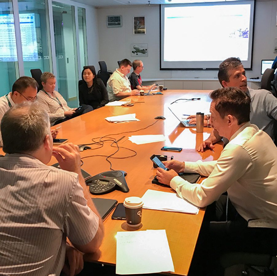 People in a boardroom having a meeting in the Integrated Operations Centre (IOC) at Cathay Pacific’s headquarters