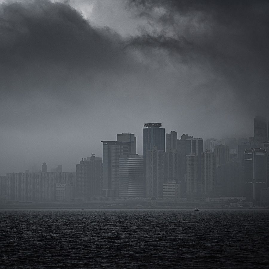 A gloomy view of Hong Kong harbour with grey clouds and sky during typhoon Hato 