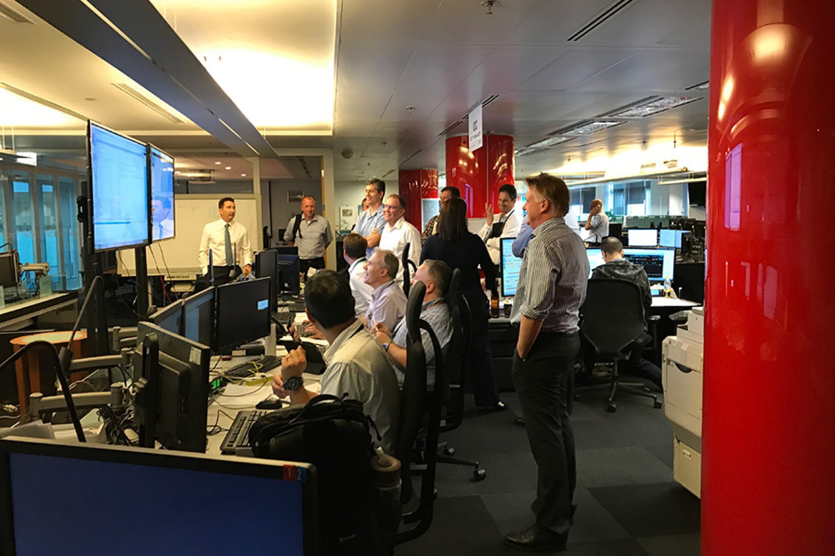 People and managers in the Integrated Operations Centre (IOC) at Cathay Pacific’s headquarters observing typhoon hato from computer screens