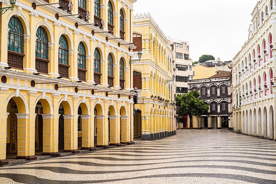 Iconic yellow buildings in an empty Senado Square in Macao. 