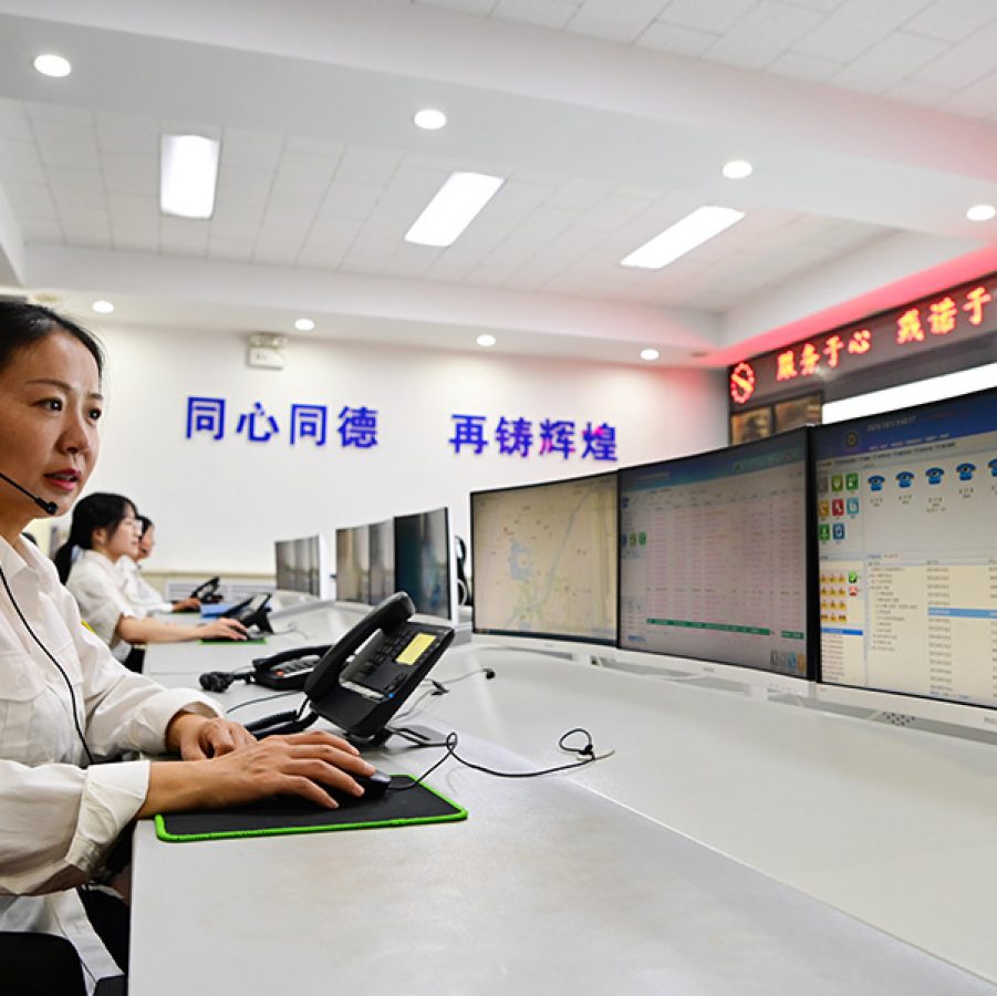 A woman with a headset at a call centre.