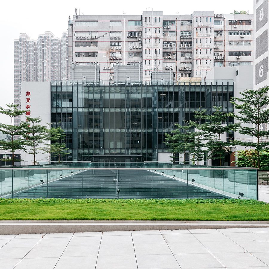 The rooftop park at The Mills, which consists of trees and a small lawn.