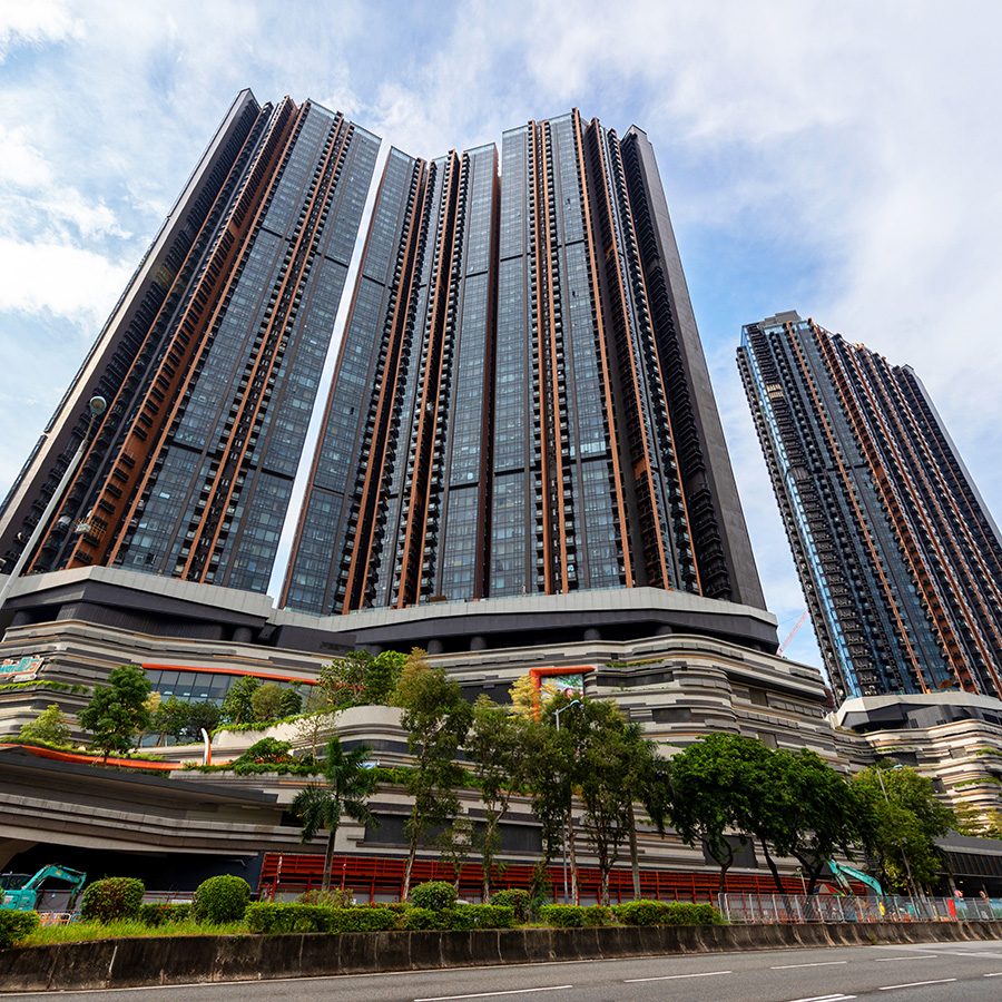 Tall buildings in Tai Wai with trees in front.