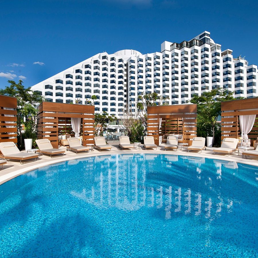 View of the hotel swimming pool with Crown Hotels Perth in the background.