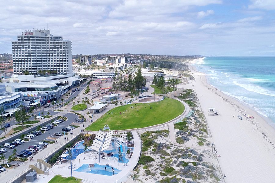 View of the beach and exterior of Rendezvous Hotel Perth Scarborough.